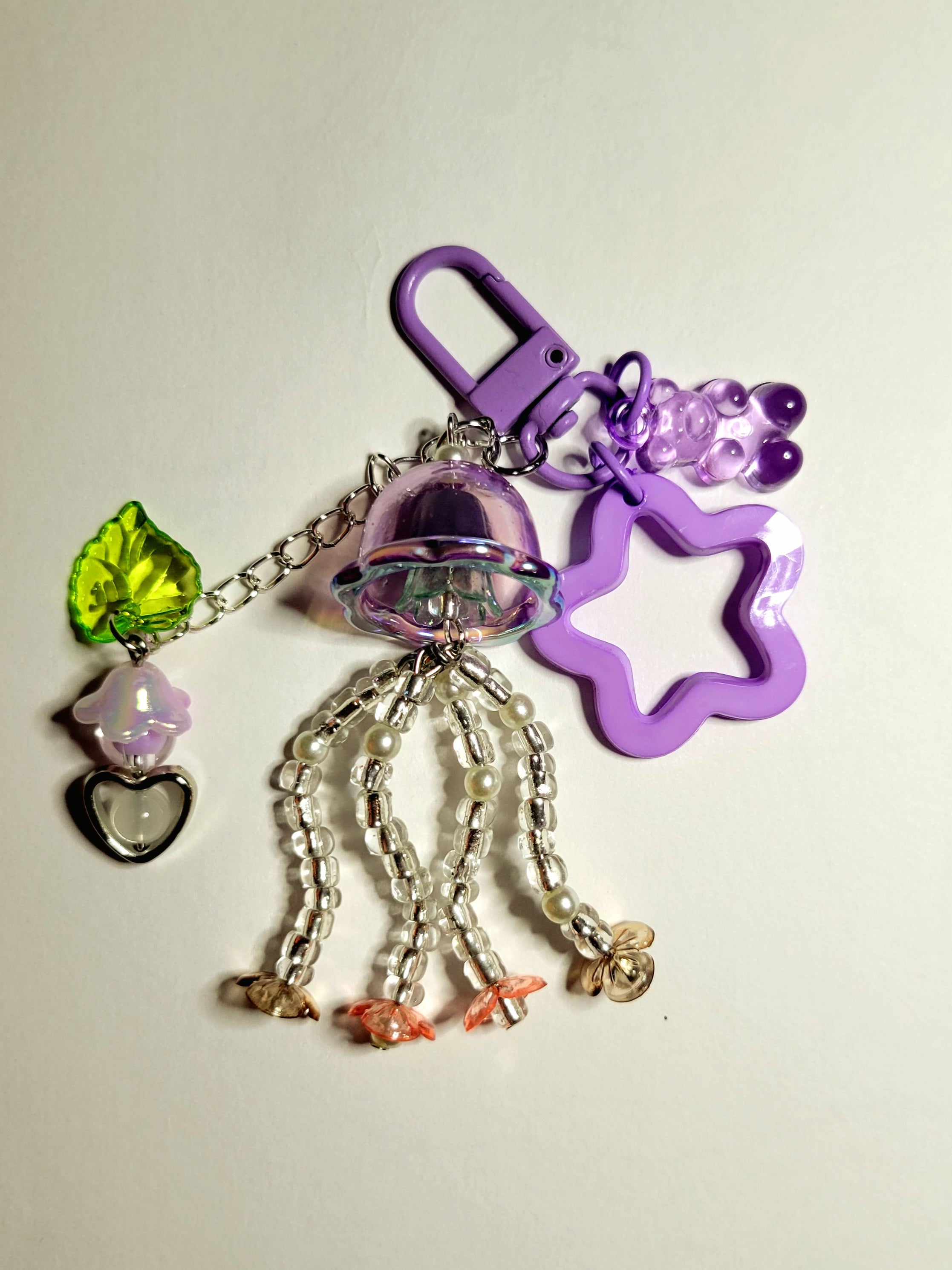 a purple jelly fish charm